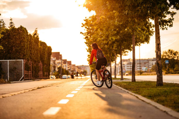 istock Young woman riding a bicycle 1307410690