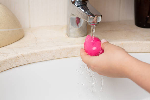 istock Woman cleansing sponge over sink 1307410838