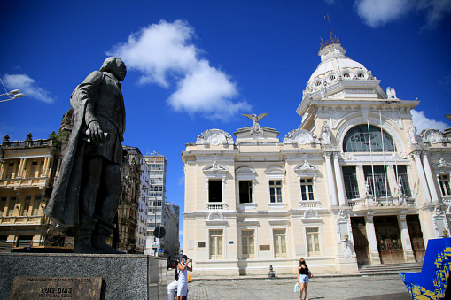salvador, bahia, brazil - february 10, 2021: statue of Thome de Sousa and in depth the Rio Branco palace in the city of Salvador.