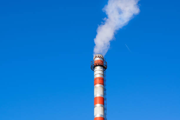 istock Factory chimney against the blue sky 1307412668