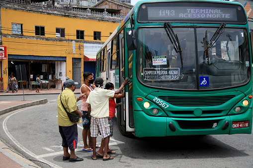 salvador, bahia, brazil - february 8, 2021: people are seen getting on public transport buses at the Barroquinha terminal, in the city of Salvador.
