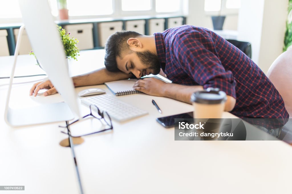 Office Man Sleeping While Working On The Computer In Modern Office office-man-sleeping-while-working-on-the-computer-in-modern-office