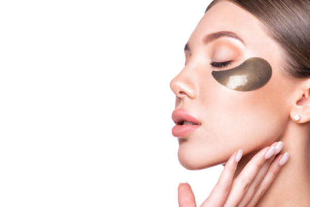 istock Beautiful model woman with collagen and hydrogel eye patch. 1307415504