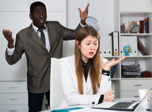 istock Upset woman with angry boss 1307415558