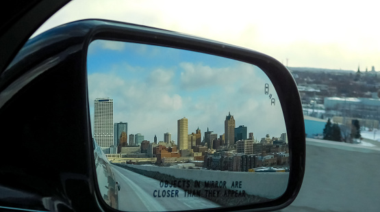 City Of Milwaukee Panorama In The Rear-view Mirror Of A Car
