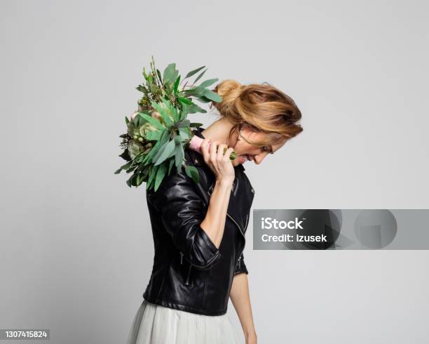 Bride Wearing Weeding Dress And Leather Jacket Stock Photo - Download Image Now - Women, Fashion Model, Flower