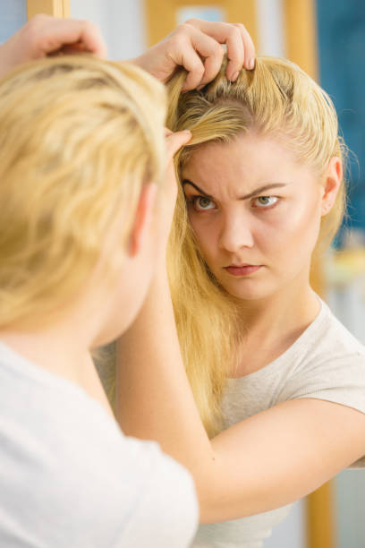 istock Female having problem with blonde hair 1307416626