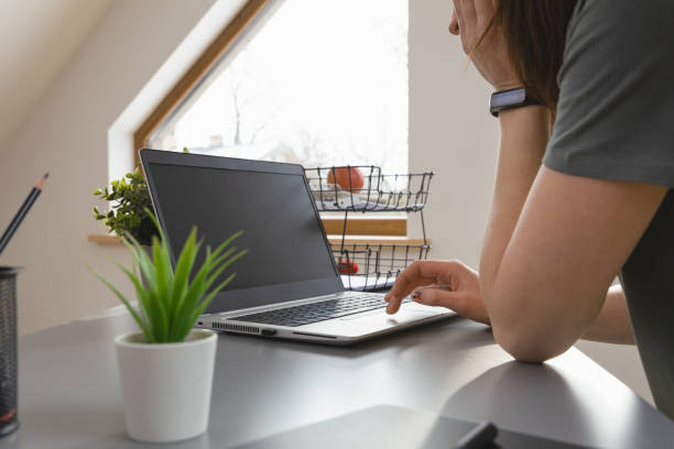 istock Women browsing in internet by using a mouse pad. Working from home a new normal working concept. 1307416936
