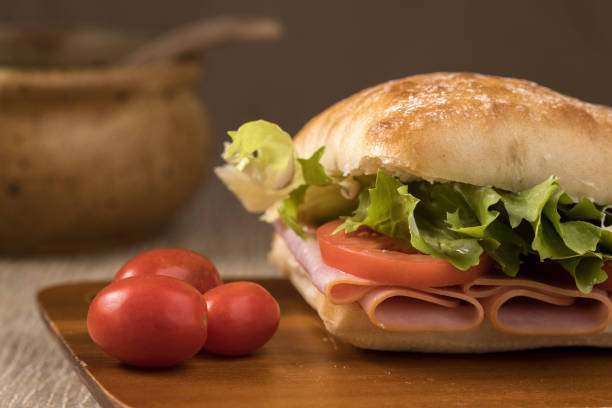 istock Close up of ham sandwich on a roll. 1307418675