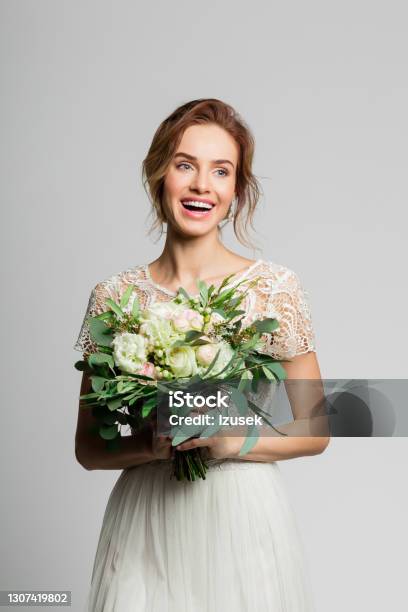 Portrait Of Beautiful Bride Holding Flowers Stock Photo - Download Image Now - Adult, Adults Only, Beautiful People