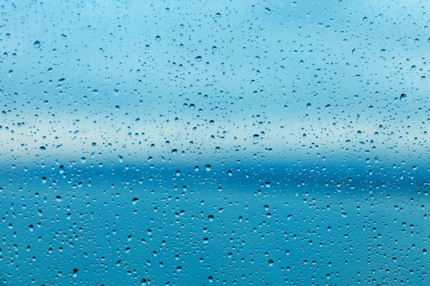 istock Raindrops on the transparent window pane. Background of raindrops. 1307420881