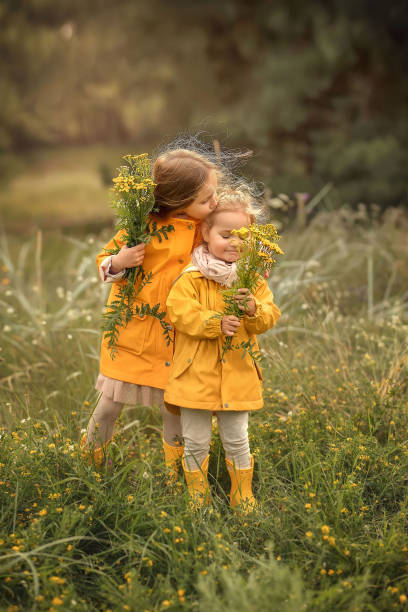 istock Two sisters in the park. 1307421036