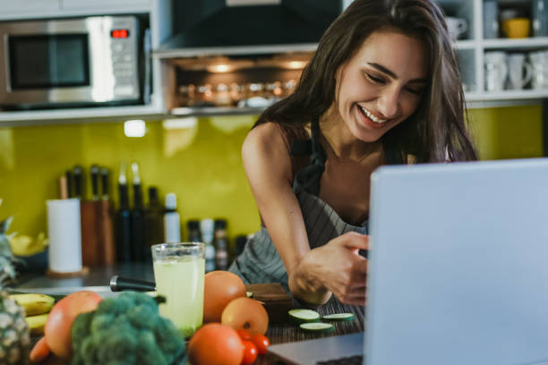 istock Young woman looking at a recipe online 1307421571