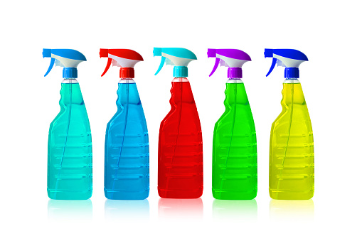 A row of colorful detergent bottles on white background