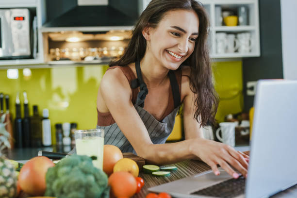 istock Young woman looking at a recipe online 1307421627