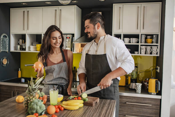 istock Happy couple is cooking together 1307422240
