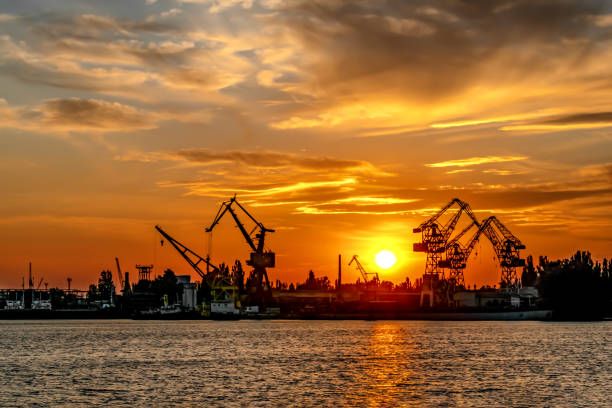 istock Sunset silhouette of Kherson port (Ukraine) 1307424272