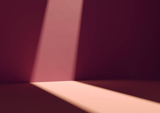 istock Illuminated square display podium for your product. Burgundy red wall in background. 1307424899