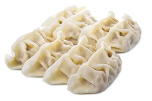 Photo of raw dumplings or gyoza, traditional Japanese cuisine isolated on white background