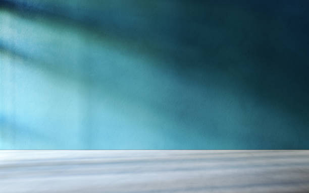 istock 3D rendering of empty room. Concrete floor and teal wall. 1307425552