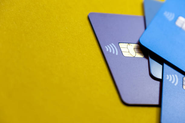 Still life blue credit cards on a yellow background