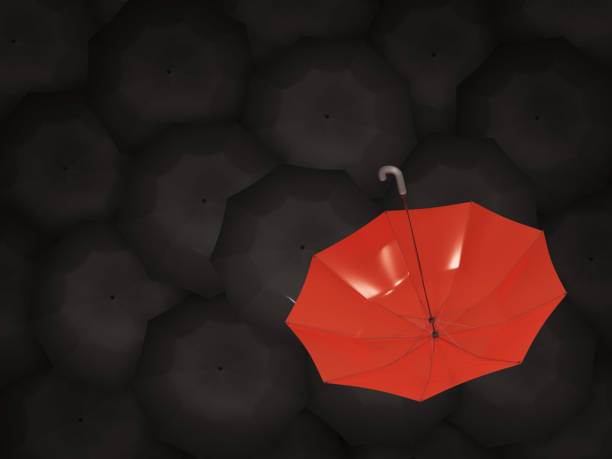 istock A red umbrella faces up surrounded by many black umbrellas.3d rendering illustration. 1307430108