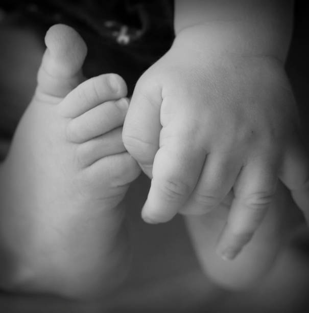 istock Baby's fingers and toes 1307430846