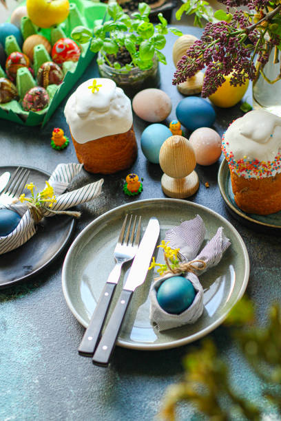 istock easter table setting bunny napkin, easter cake and painted eggs healthy meal top view copy space for text food background rustic image 1307431016