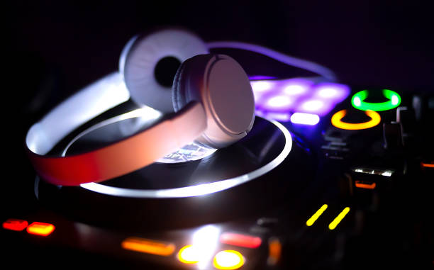 istock music console and white headphones for DJ. DJ console for experiments with music 1307432574
