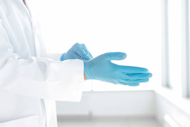 istock doctor removing protective gloves . photo with a copy-space 1307434002