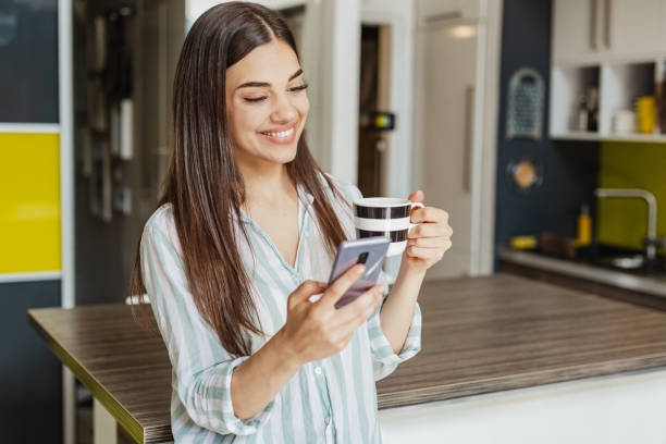 istock Morning coffee and using mobile phone 1307435034