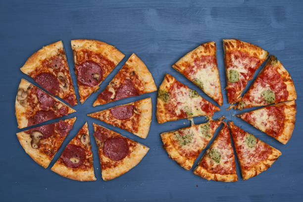 istock Delicious pizza on wooden board 1307436749