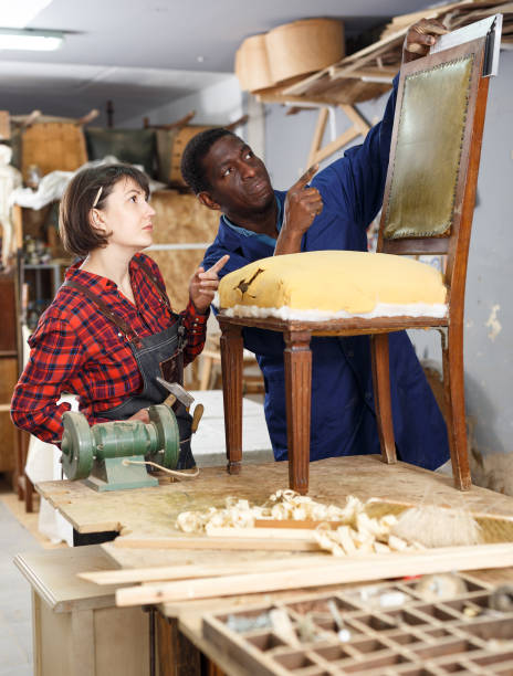 istock Restorers working with vintage armchair 1307437939