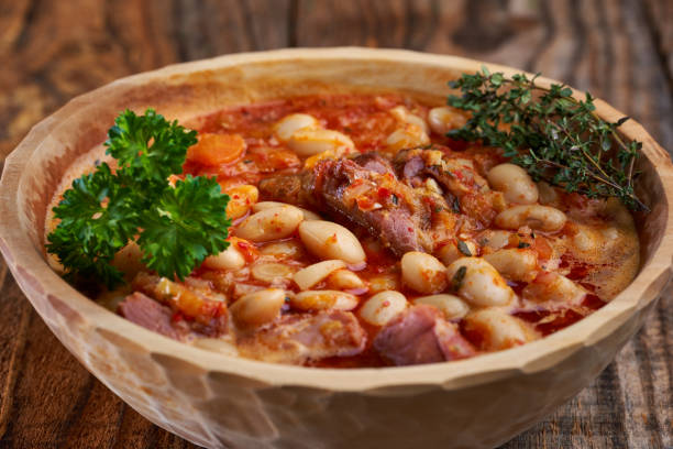 istock Smoked pork and beans stew on a rustic table 1307438118