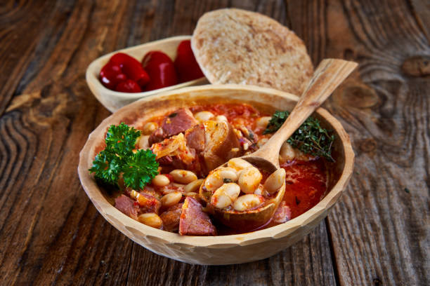 istock Smoked pork and beans stew on a rustic table 1307438126