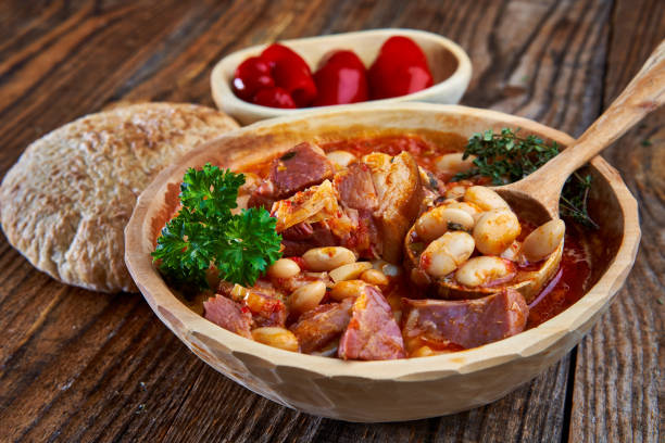 istock Smoked pork and beans stew on a rustic table 1307438133