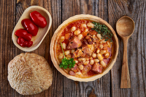 istock Smoked pork and beans stew on a rustic table 1307438139