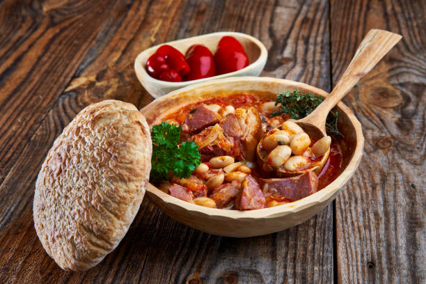 istock Smoked pork and beans stew on a rustic table 1307438143