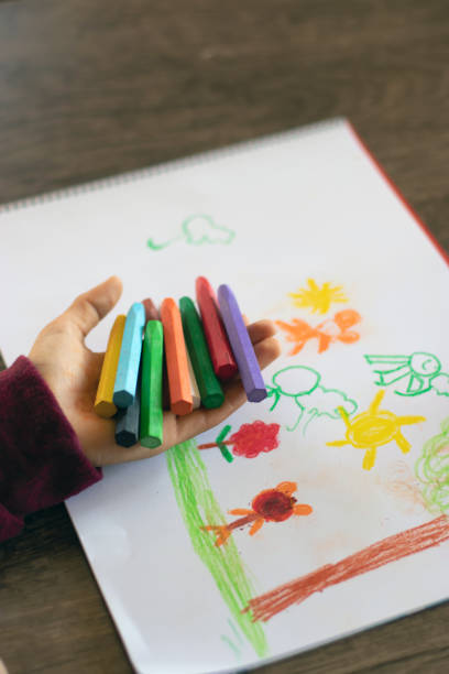istock The child painting with colored paints 1307440740