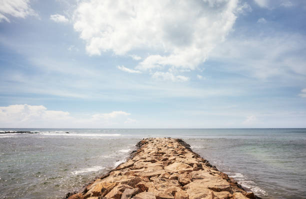 istock Rocky pier on a sunny day. 1307440931