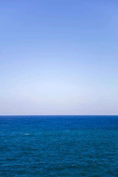 istock Blue sky with blue sea waves water surface 1307446453