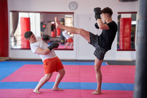 istock Overweight kickboxer sparring with his partner 1307447169