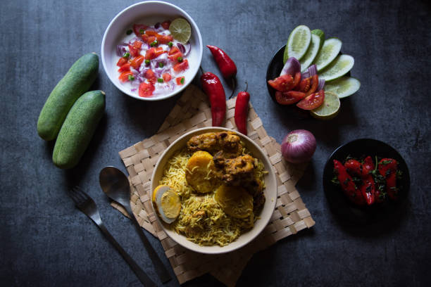 istock Chicken biryani or traditional rice with salad ingredients and condiments. 1307447752
