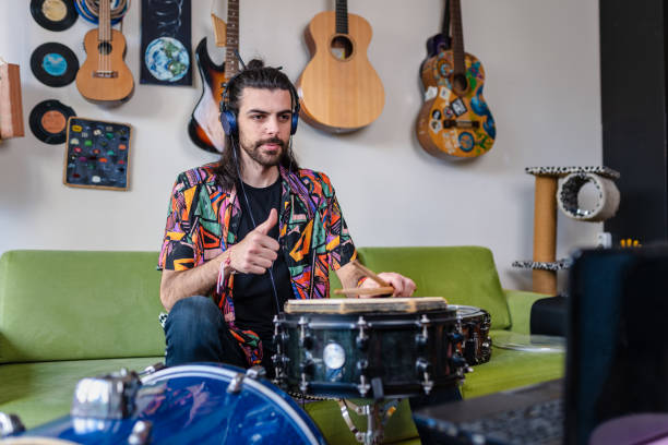 istock Young Drummer having video concert during lockdown 1307447959