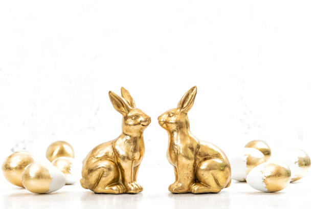 istock Golden bunnies Easter eggs decoration 1307450758