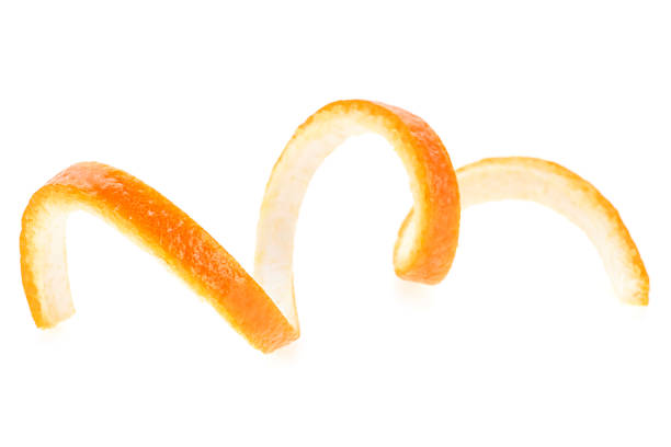 torsione arancione isolata su sfondo bianco. buccia d'arancia da vicino. cedro arancione. - garnish foto e immagini stock