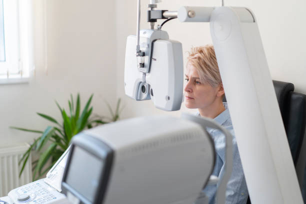 istock Woman in modern clinic waiting for her eye test 1307450949