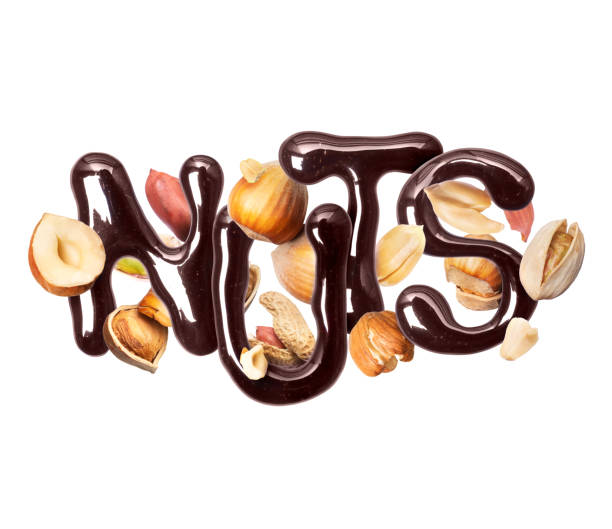 istock Inscription Nuts made of chocolate with different nuts, isolated on white background 1307452312