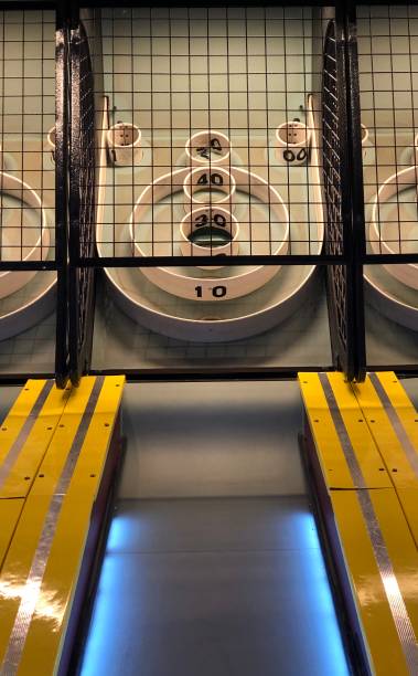 View down the lane of a skee ball game at an amusement park