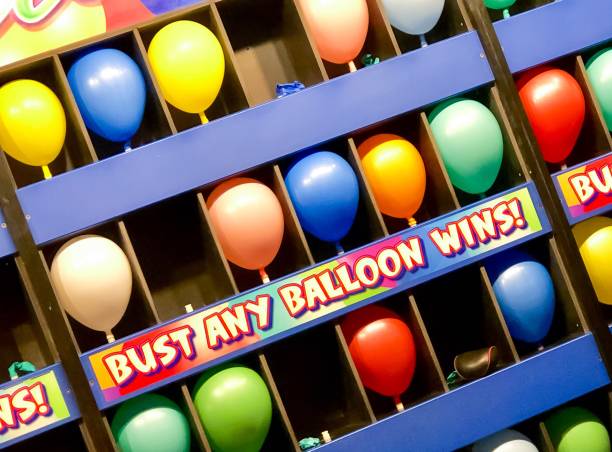 balloon pop game - rubber dart imagens e fotografias de stock